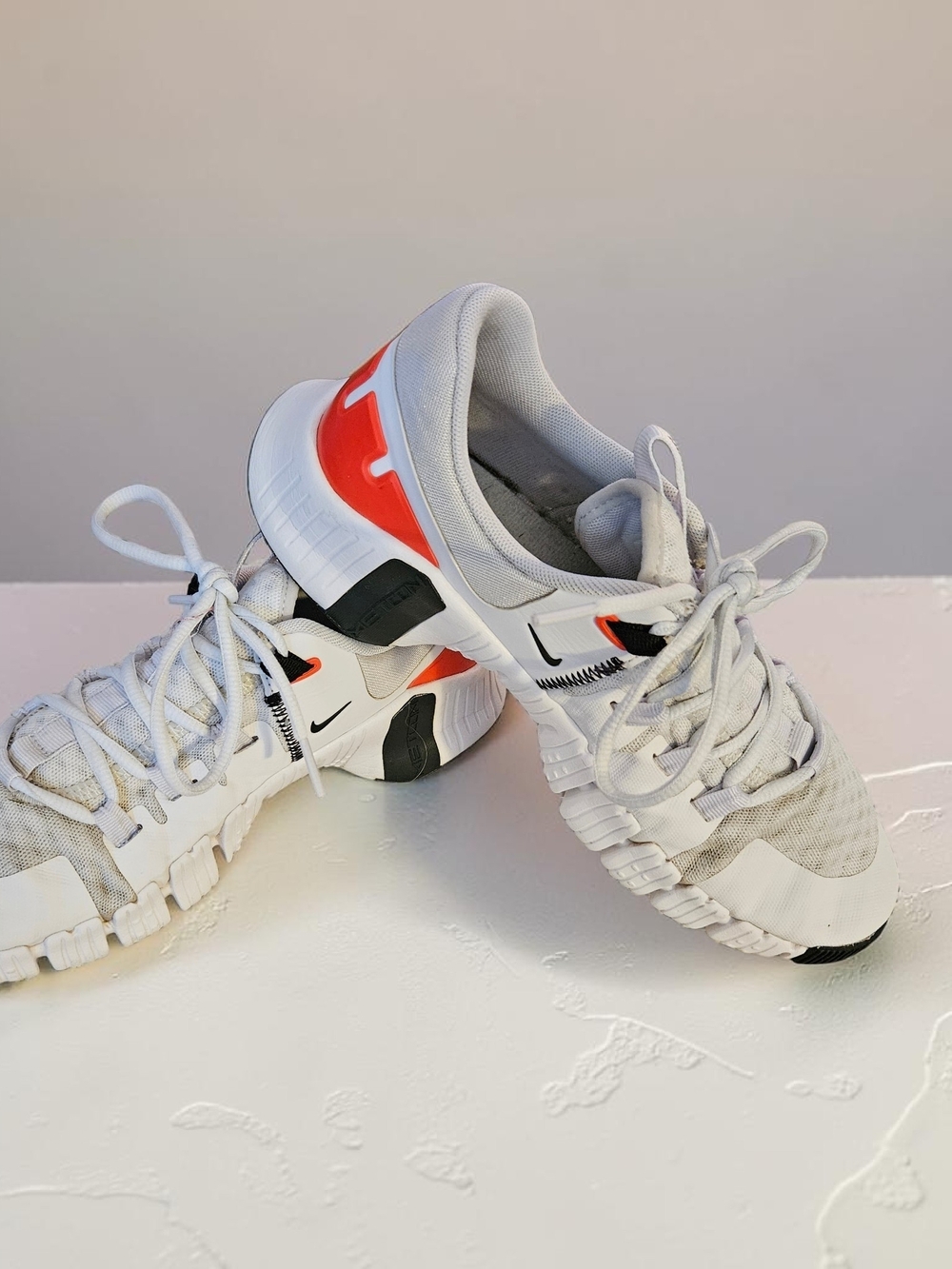 Nike Free White Athletic Sneakers with Orange and Black Accents